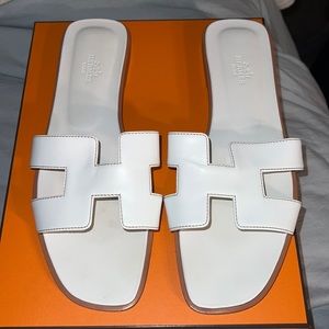Hermes Sandal in Box calfskin with iconic "H" cut-out.
An iconic Hermes style